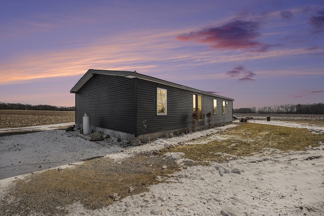 view of property exterior at dusk