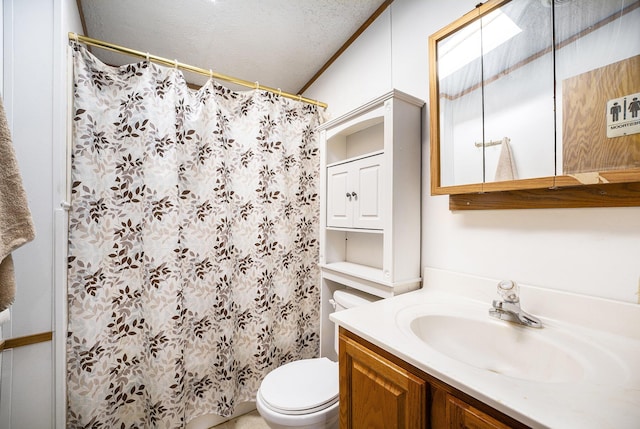 bathroom featuring vanity, a shower with curtain, and toilet