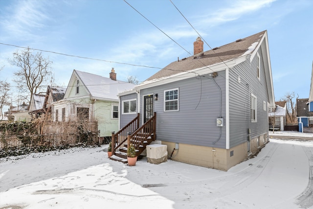 view of snow covered house