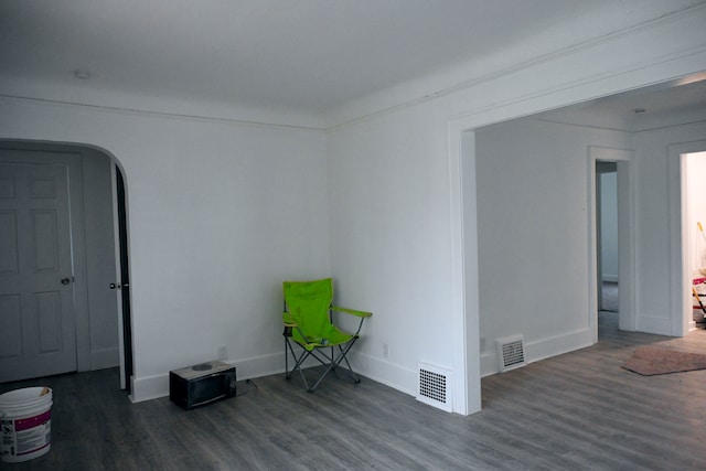 unfurnished room featuring dark hardwood / wood-style flooring