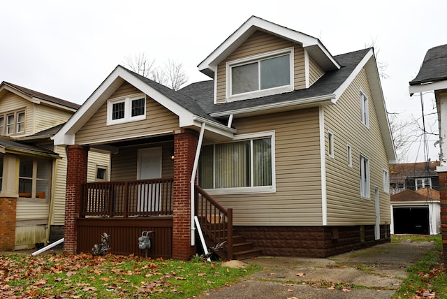 view of front of house featuring a garage and covered porch