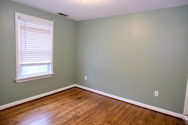 empty room featuring hardwood / wood-style flooring