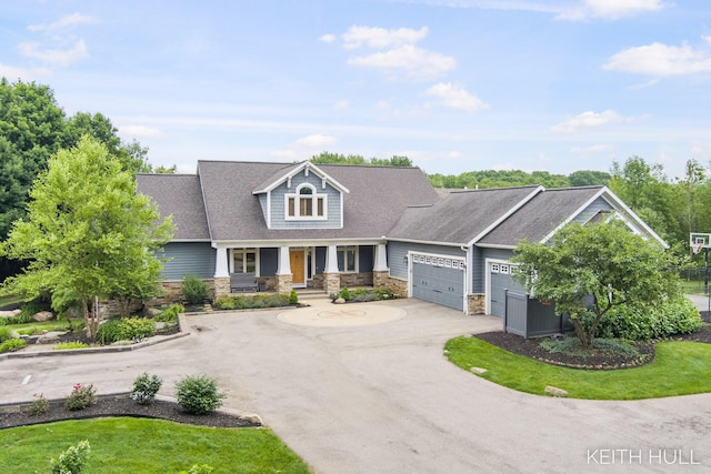 view of front of property with a garage and covered porch