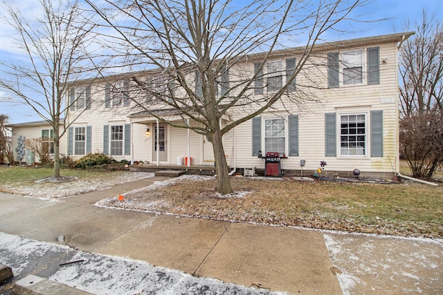 colonial-style house with a porch