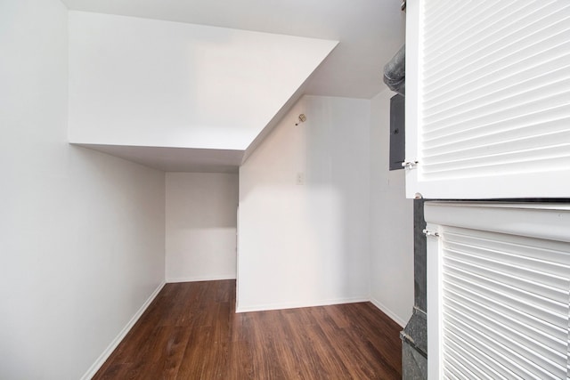 bonus room with dark hardwood / wood-style floors