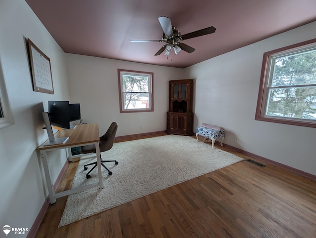 office area with ceiling fan and light wood-type flooring