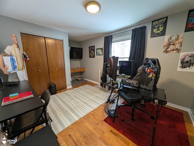 home office with light hardwood / wood-style floors