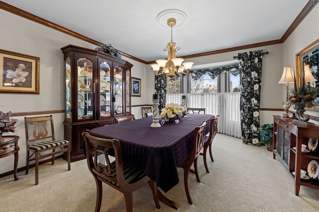 carpeted dining room featuring crown molding and a chandelier