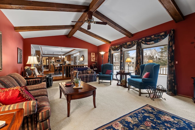 carpeted living room featuring vaulted ceiling with beams and ceiling fan with notable chandelier