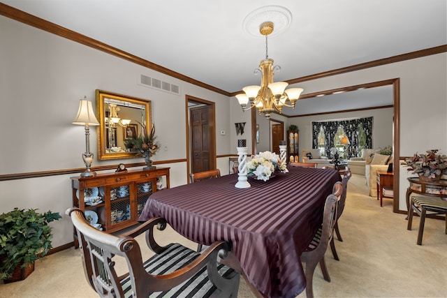 dining space with ornamental molding, light carpet, and an inviting chandelier