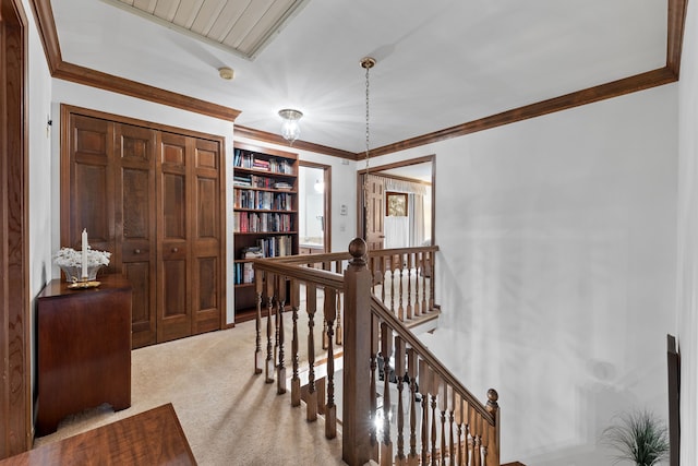 hall featuring light carpet and crown molding