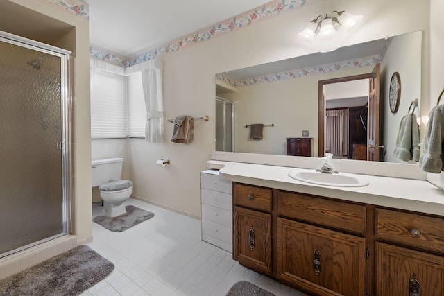 bathroom featuring vanity, walk in shower, and toilet