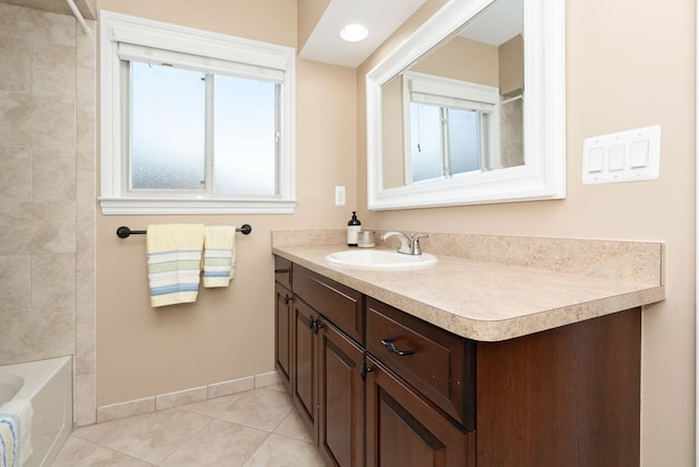 bathroom with vanity, bathing tub / shower combination, and tile patterned flooring