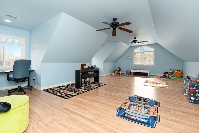 rec room featuring light hardwood / wood-style flooring and vaulted ceiling