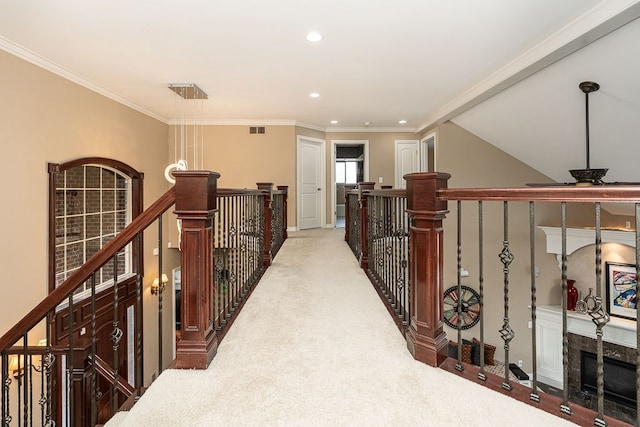 hallway featuring crown molding and carpet floors