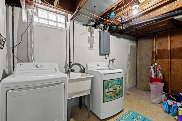 clothes washing area with sink, washing machine and clothes dryer, and electric panel