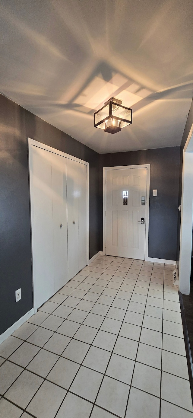 entrance foyer featuring light tile patterned flooring