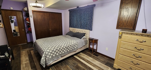 bedroom featuring dark hardwood / wood-style flooring and a closet