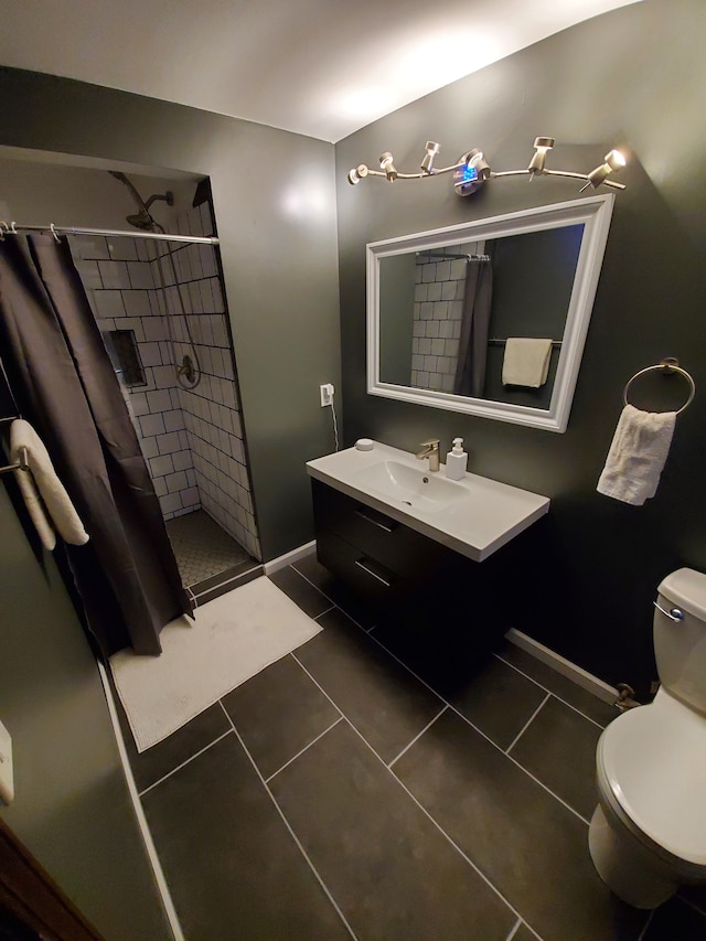 bathroom with tile patterned flooring, toilet, vanity, and a shower with shower curtain