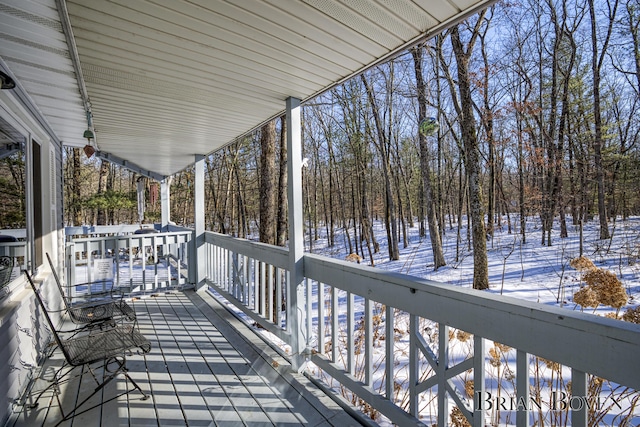 view of snow covered deck