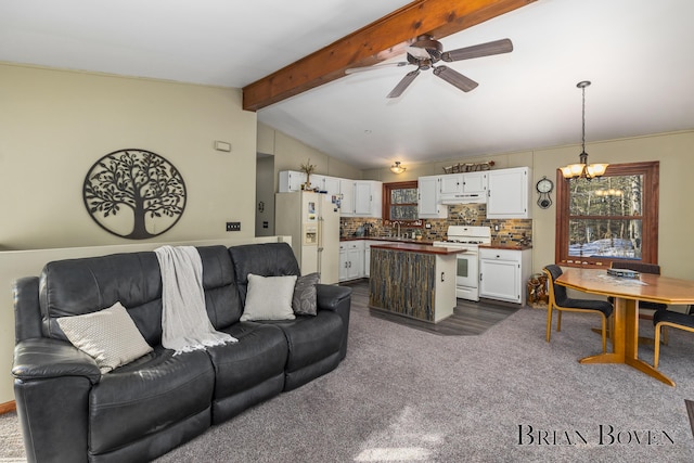 living room with dark carpet, sink, ceiling fan with notable chandelier, and lofted ceiling with beams