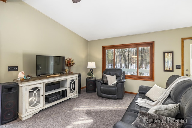 living room featuring vaulted ceiling and carpet flooring