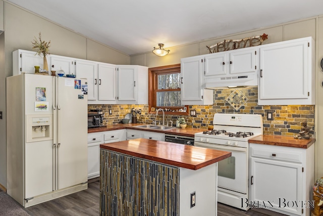 kitchen featuring tasteful backsplash, white cabinetry, sink, a center island, and white appliances