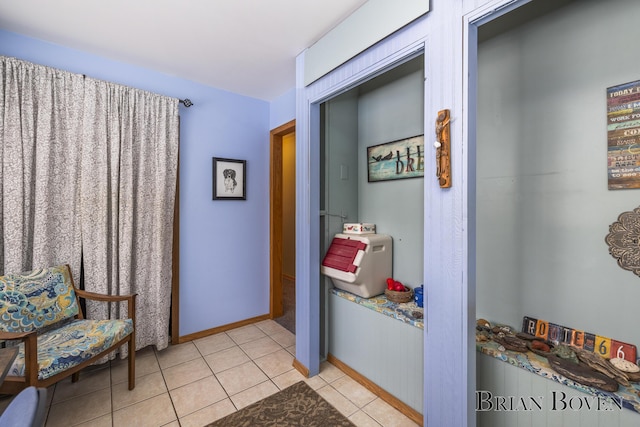 hallway featuring light tile patterned flooring