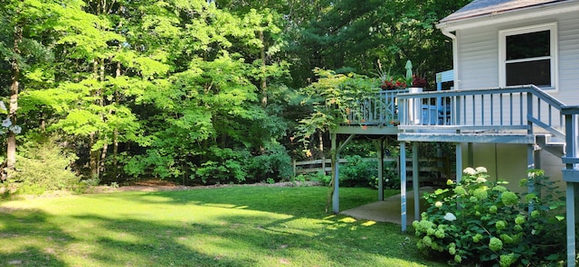 view of yard with a wooden deck