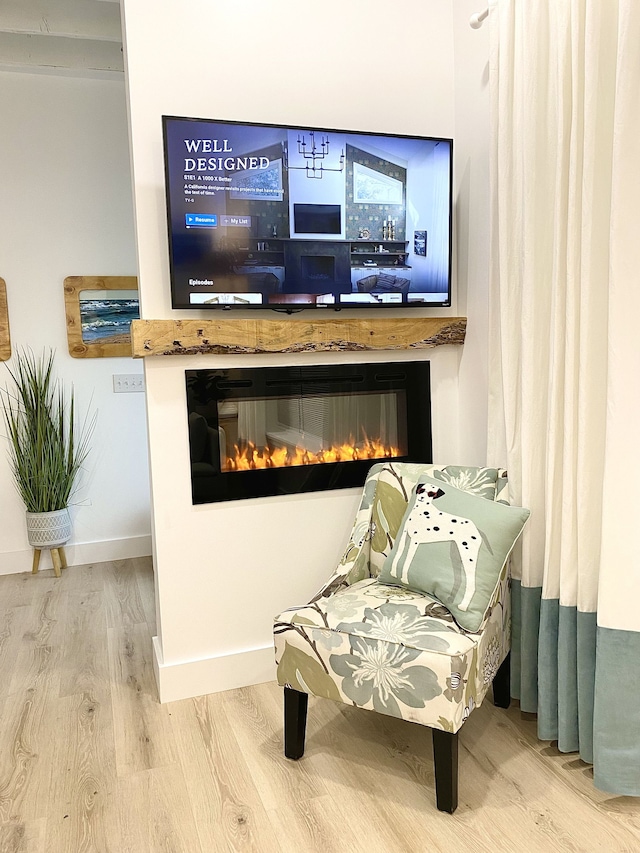 sitting room with hardwood / wood-style floors