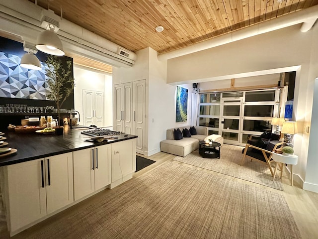 kitchen featuring white cabinetry, wood ceiling, and light hardwood / wood-style flooring