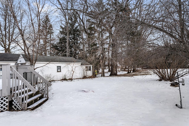 view of yard covered in snow