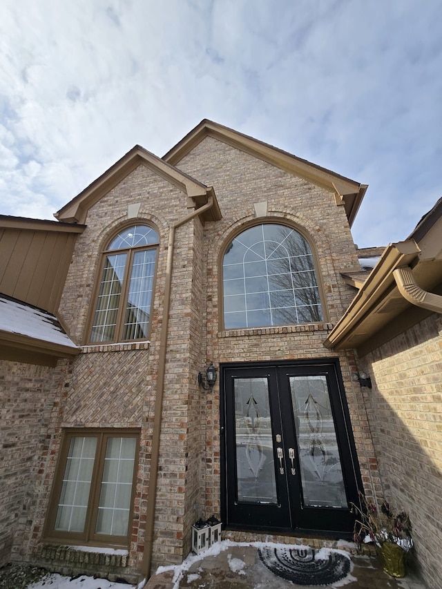 view of exterior entry featuring french doors