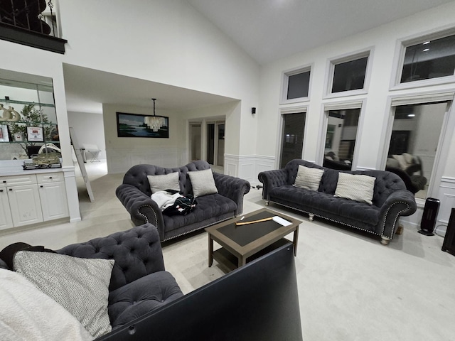 living room featuring high vaulted ceiling