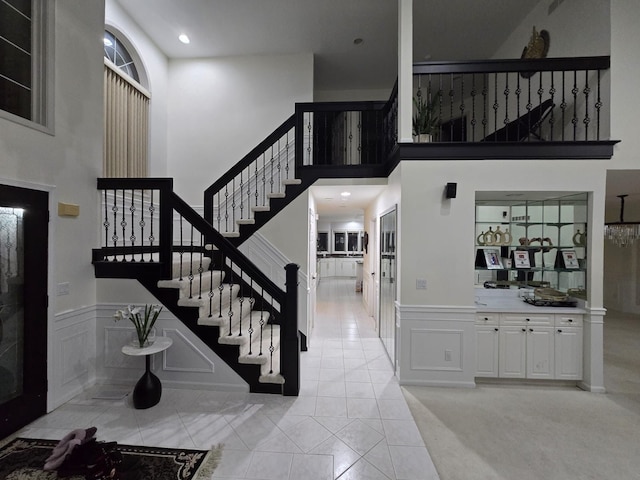 entryway with a towering ceiling