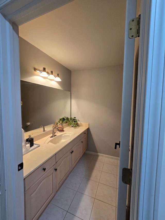 bathroom with tile patterned flooring and vanity