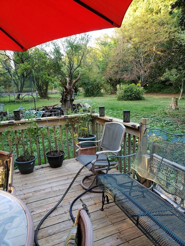 wooden deck with a trampoline