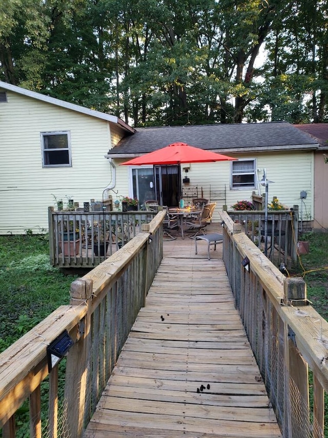 back of house with a wooden deck