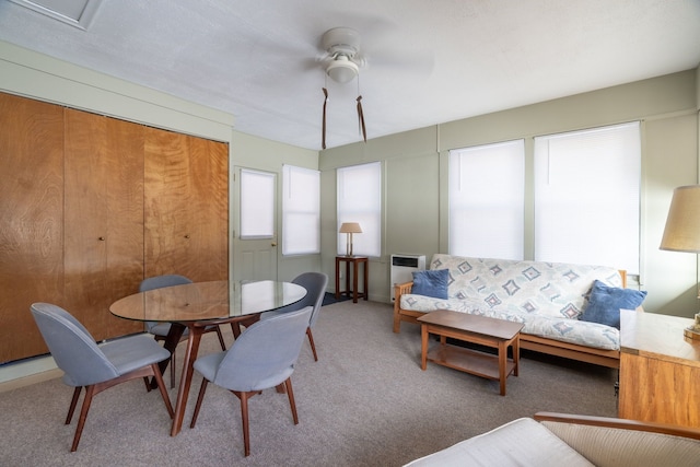 dining room featuring carpet floors and a ceiling fan