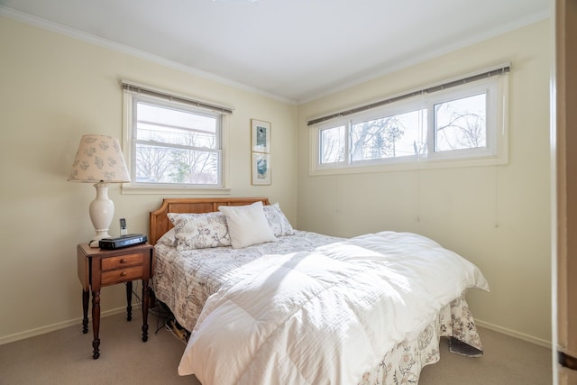 bedroom featuring light colored carpet, crown molding, and baseboards