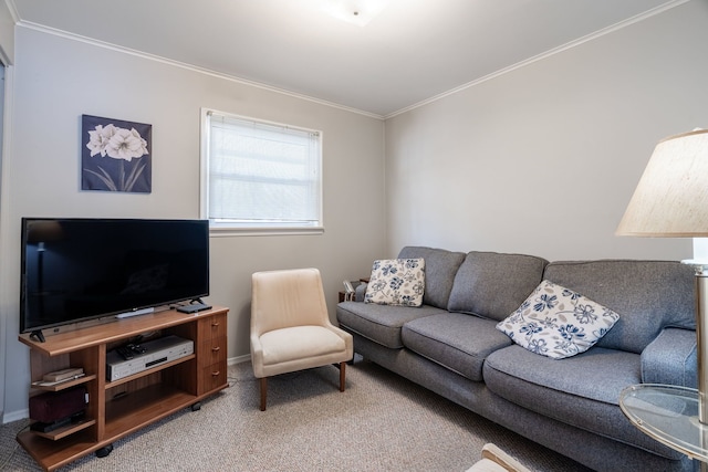 carpeted living area with ornamental molding and baseboards