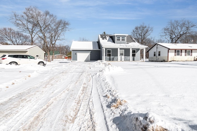 view of front of home featuring a garage and covered porch