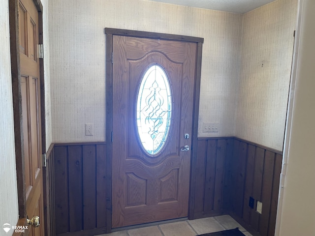 foyer entrance featuring light tile patterned floors