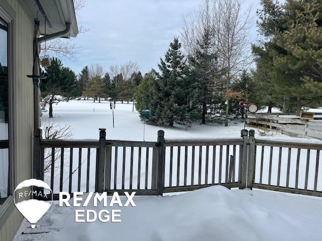 view of snow covered deck