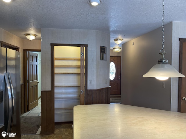 foyer with a textured ceiling