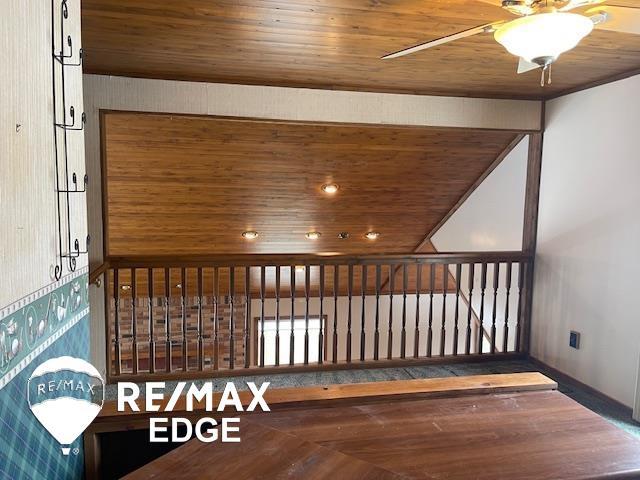 bonus room featuring ceiling fan and wood ceiling