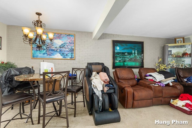 carpeted living room featuring beamed ceiling, brick wall, and an inviting chandelier