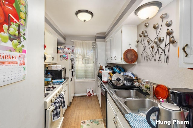 kitchen with pendant lighting, black appliances, light hardwood / wood-style floors, and white cabinets