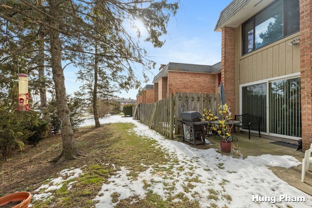 view of yard covered in snow