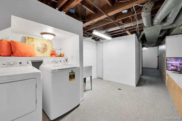 clothes washing area featuring independent washer and dryer